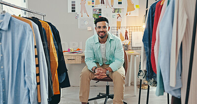 Buy stock photo Clothing rack, creative and portrait of fashion designer man in textile workshop for production. Confident, smile and wall with happy style director at desk in office for manufacturing process