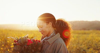 Buy stock photo Countryside, bouquet and woman with flowers, sunset and field with lens flare, happiness and nature. Person, outdoor and girl with environment, gratitude for present and gift with freedom and smile