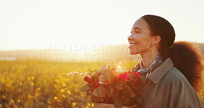 Buy stock photo Countryside, bouquet and woman with flowers, thinking and field with lens flare, happiness and sunset. Person, outdoor and girl with environment, gratitude for present and gift with freedom or nature