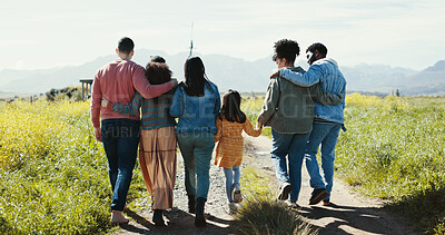 Buy stock photo Family, friends and kid walking in park together for summer holiday, travel or vacation. Back, holding hands or love and group of people outdoor on dirt road in field of green for getaway or trip