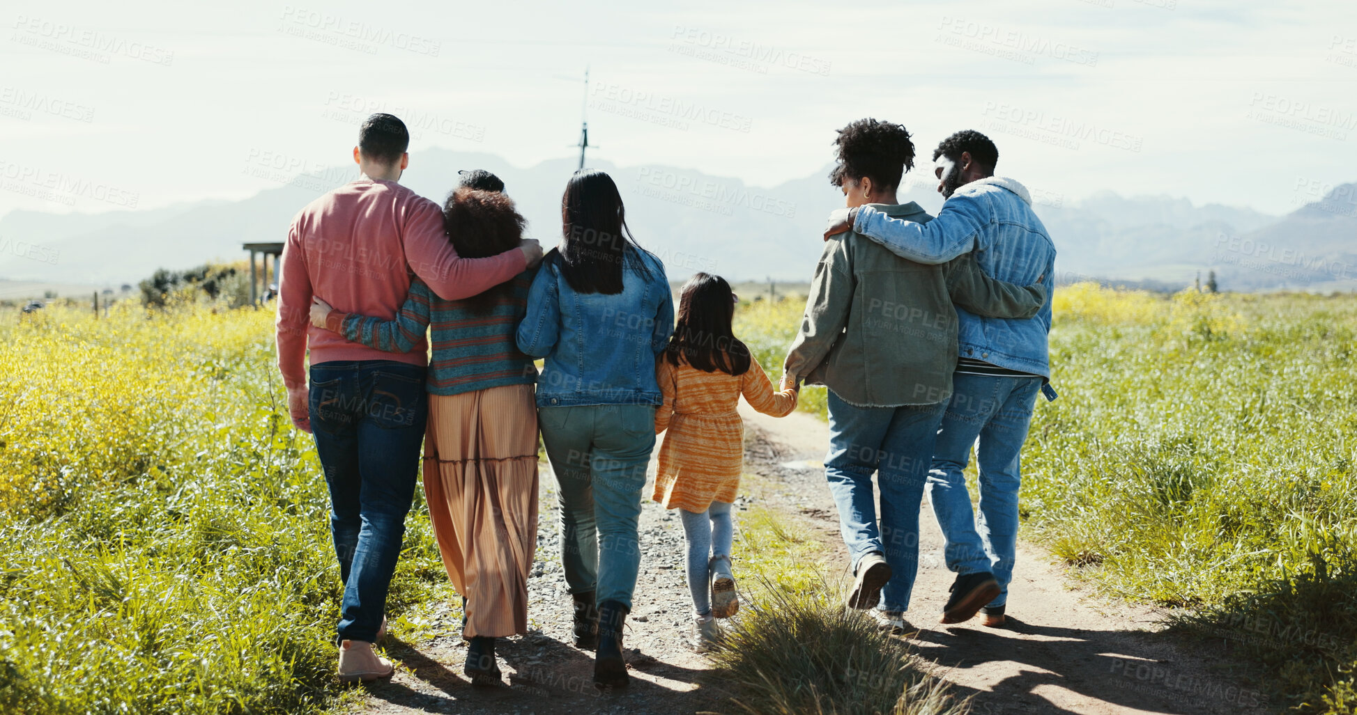 Buy stock photo Family, friends and kid walking in park together for summer holiday, travel or vacation. Back, holding hands or love and group of people outdoor on dirt road in field of green for getaway or trip