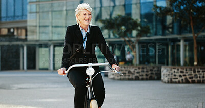 Buy stock photo Bicycle, happy and mature businesswoman in city with travel, journey or trip to office building. Commuting, smile and professional female executive with eco friendly transport to work in urban town.