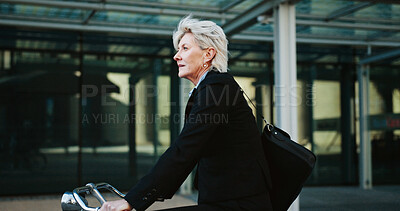 Buy stock photo Bicycle, rush and mature businesswoman in city with travel, journey or trip to office building. Commuting, career and professional female executive with eco friendly transport to work in urban town.