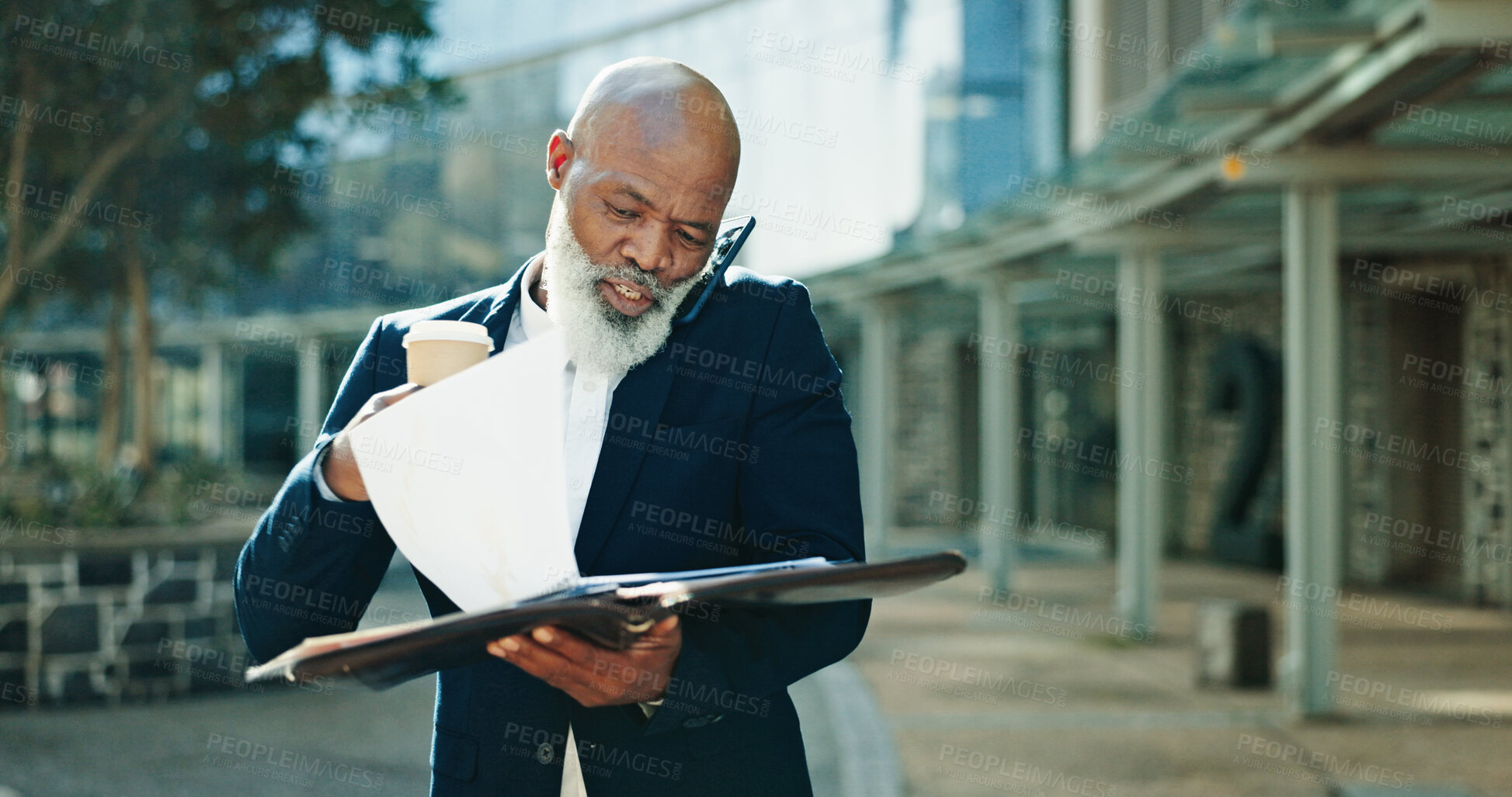 Buy stock photo Phone call, documents and multitasking with business black man in city for lawyer, legal counsel or time management. Attorney advisor, contact and paperwork with mature employee in Kenya for schedule