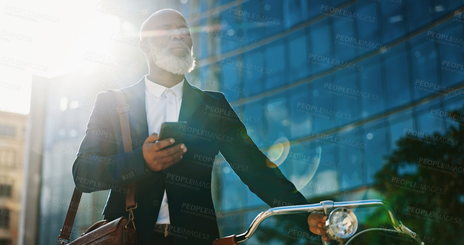 Buy stock photo Bike, phone and planning with business black man outdoor in city for communication or commute. Building, directions on mobile app or thinking and mature employee with green transportation for cycling