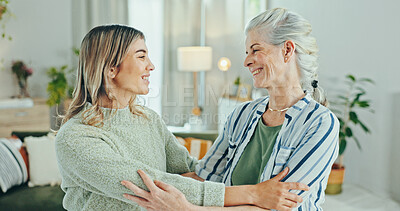 Buy stock photo Family, love and senior person with woman, hug and visit in living room of retirement home. Pensioner, grandmother and granddaughter with support, bonding and reunion in elderly care apartment