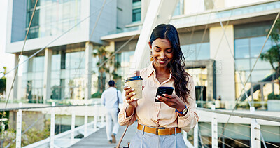 Buy stock photo Happy woman, phone and coffee with bridge for social media, communication or reading news in city. Female person, employee and travel with drink or mobile smartphone for online chat, browsing or app