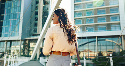 Buy stock photo Outdoor, business and woman with thinking or commuting to workplace with ideas and vision in city. Back view, female person and employee with thoughts for new job work in morning with mindset