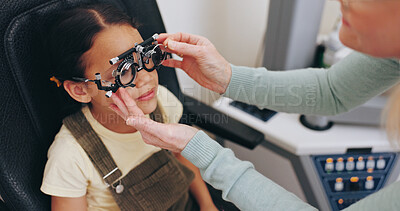 Buy stock photo Trial frame, hands or child in eye test at optometry clinic for eyewear, retina health or sight wellness. Check, doctor or girl kid in assessment for optical lenses, vision exam or spectacles frames
