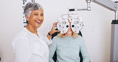 Buy stock photo Doctor, optometry and happy woman on phoropter for vision, laugh and exam for healthcare in clinic. Mature ophthalmologist, test and patient on machine for eye care, wellness and eyesight correction