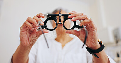 Buy stock photo Eye exam, pov and glasses with hands of woman in clinic for optometrist, trial frame and vision. Medical, ophthalmologist and lens with person and tools for check, visual test and assessment
