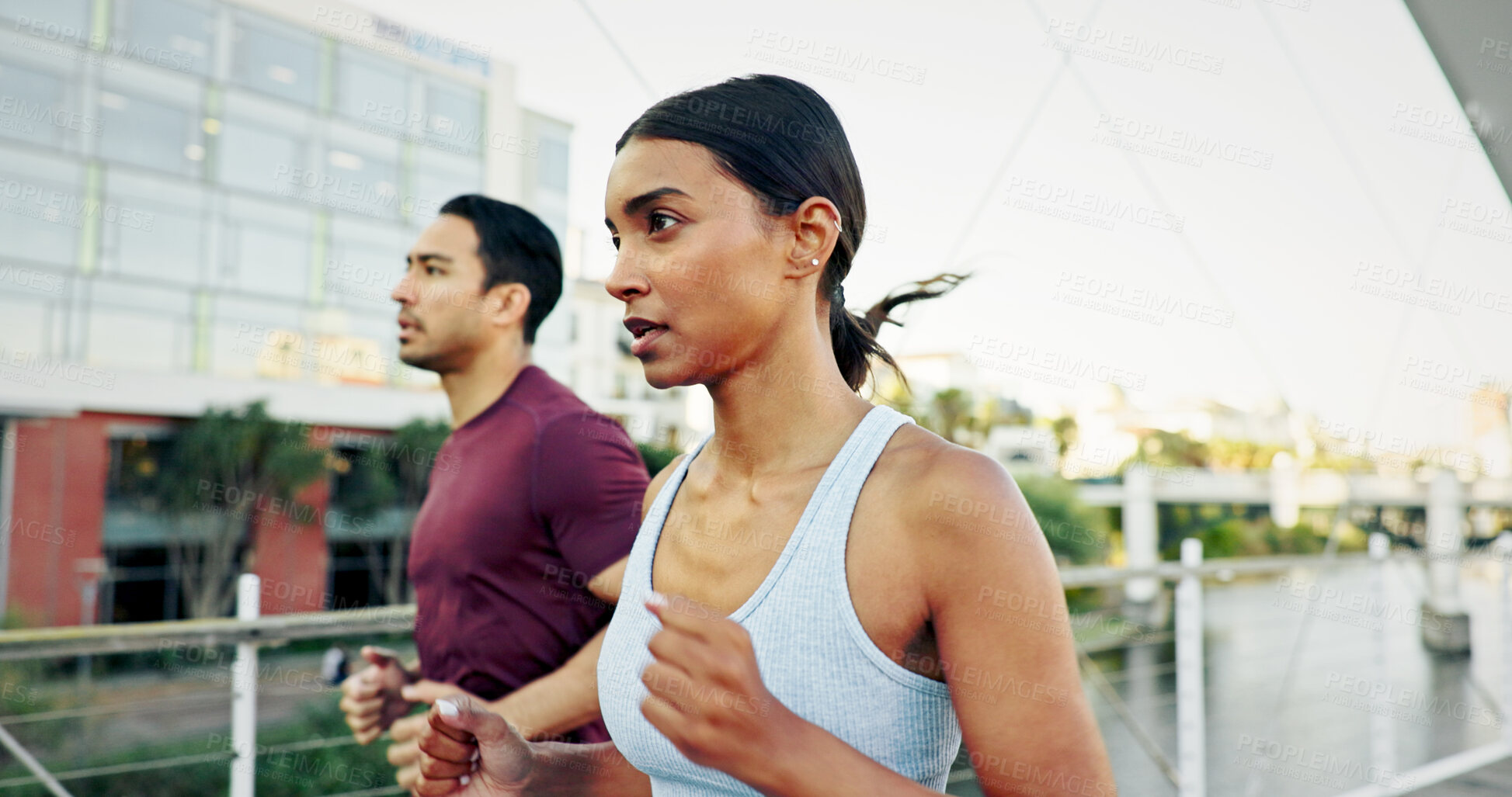 Buy stock photo Interracial couple, exercise and running in city for workout, fitness or training together in urban town. Man, woman and athlete with cardio, sports or marathon for endurance and health or wellness