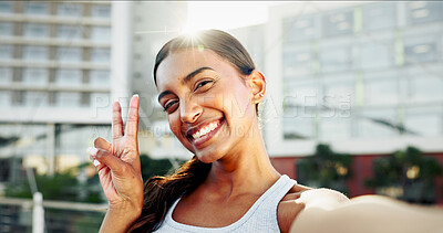 Buy stock photo Fitness, portrait and woman with selfie, peace sign and workout or exercise for training break on social media. Happy influencer, runner and girl in profile picture for online post or vlog in city