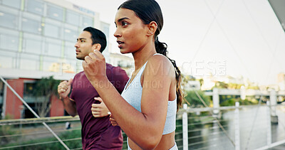 Buy stock photo Interracial couple, athlete and running in city for workout, exercise or training together in urban town. Man, woman and fitness with cardio, sports or marathon for endurance and health or wellness