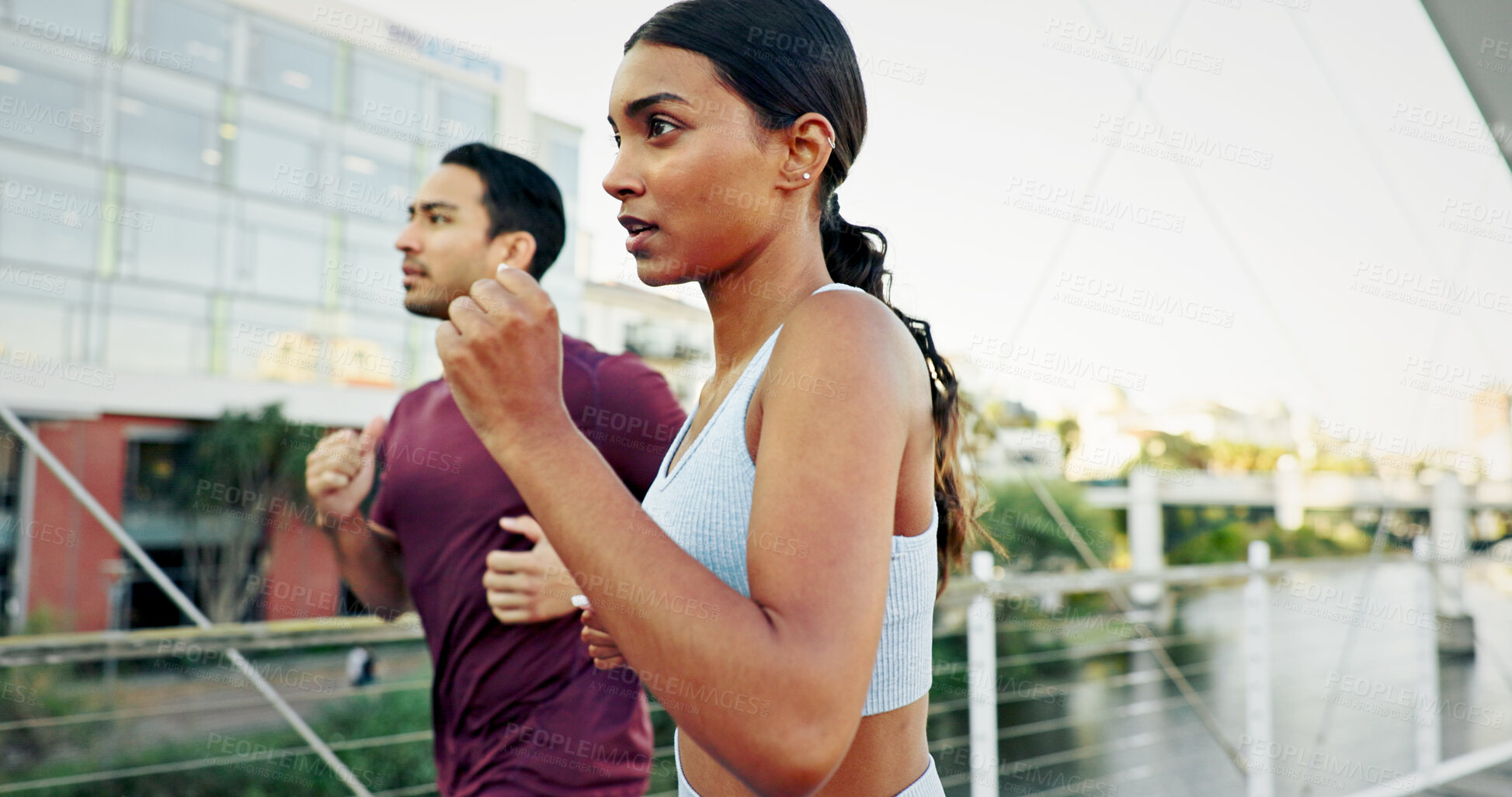Buy stock photo Interracial couple, athlete and running in city for workout, exercise or training together in urban town. Man, woman and fitness with cardio, sports or marathon for endurance and health or wellness