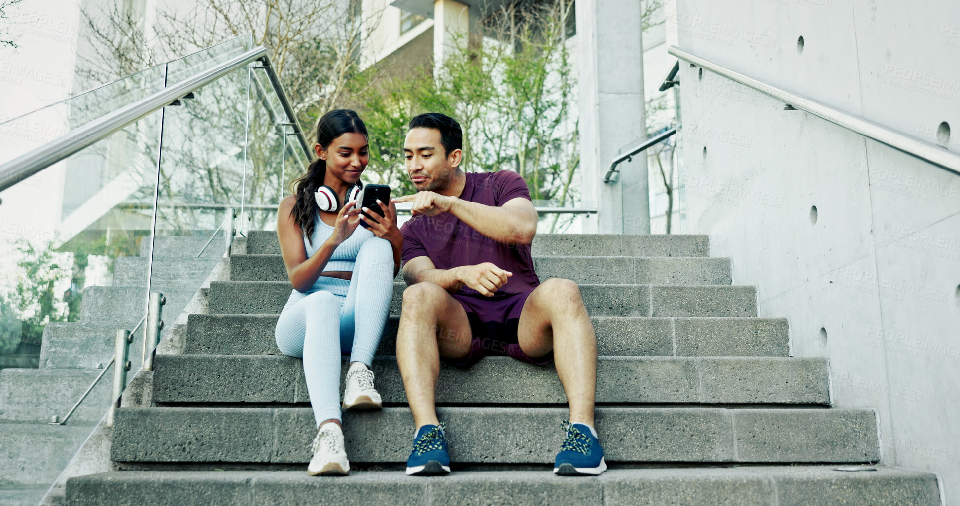 Buy stock photo Stairs, city and couple with smartphone, exercise break and smile for support and challenge in New York. Athlete, man and woman in urban town for health, wellness and training for marathon endurance