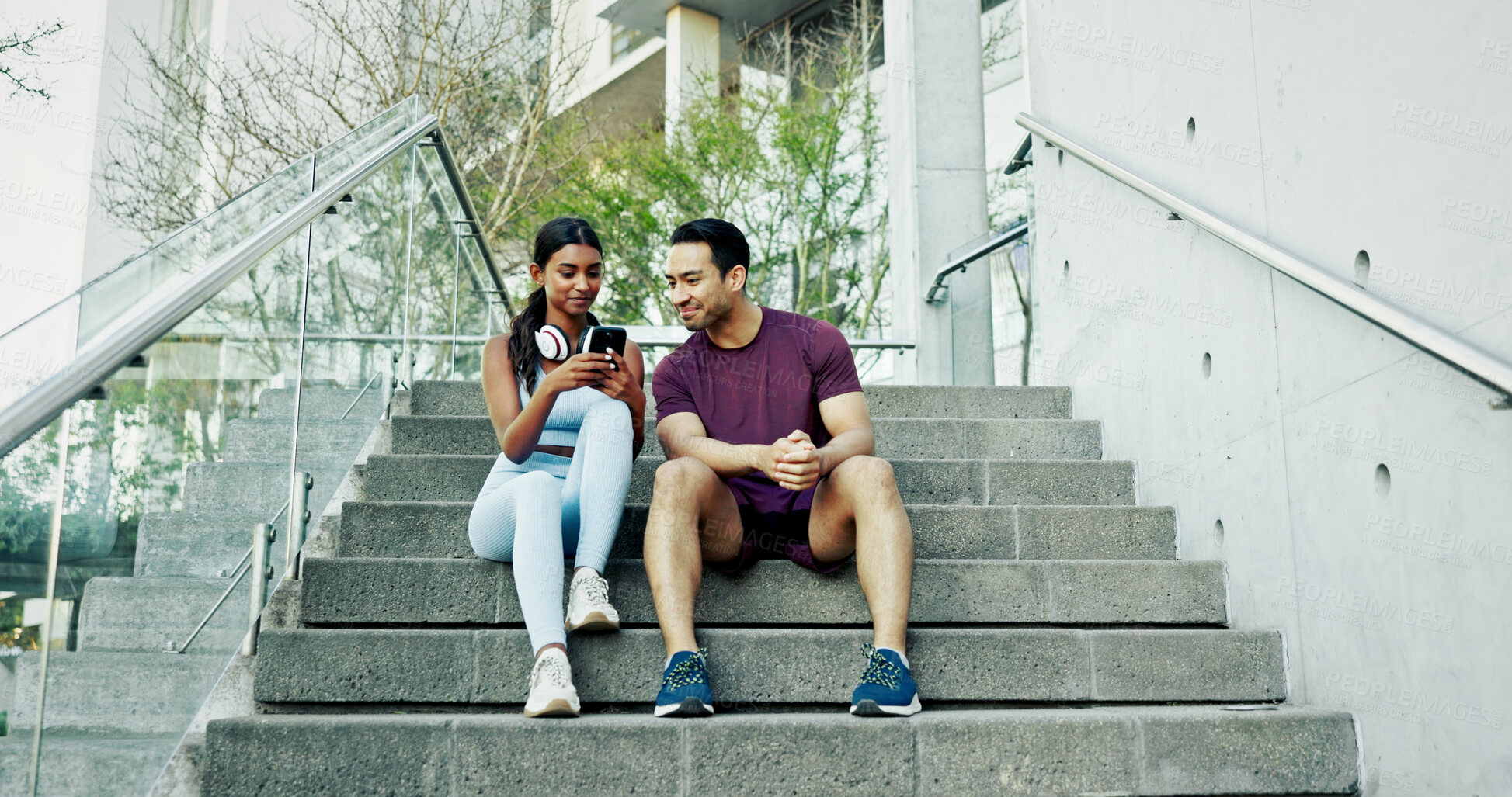 Buy stock photo Steps, city and couple with smartphone, exercise break and smile for support and challenge in New York. Athlete, man and woman in urban town for health, wellness and training for marathon endurance