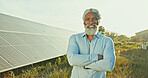 Solar energy, photovoltaic technician and arms crossed in portrait for monitoring installation or site assessment. Happy mature manager, black man or power saving project in field for grid connection