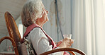 Tea cup, senior woman and thinking with relax, hydration and nutrition as pensioner in living room. Nostalgia, elderly person and reflection for wellness, mental health and memory in retirement home