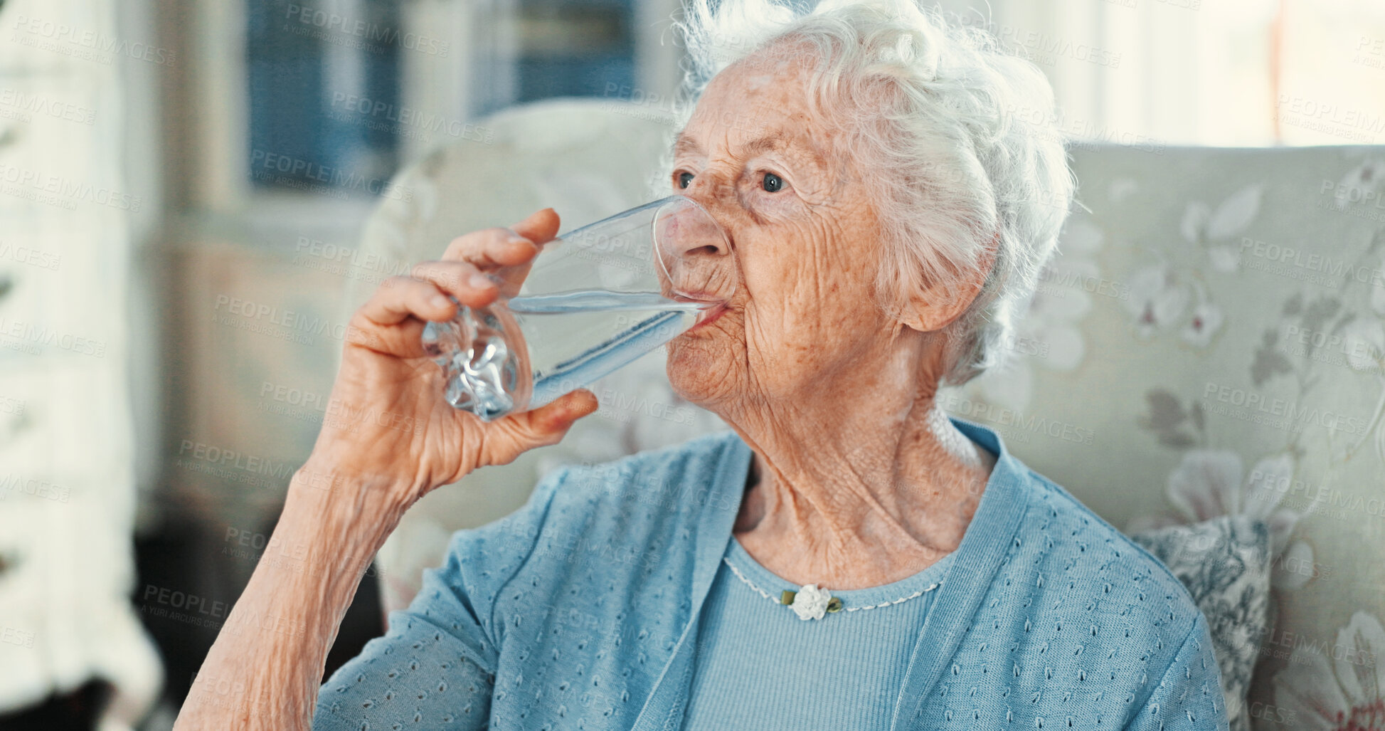 Buy stock photo House, drinking water and senior woman with wellness, hydration and aqua with nutrition. Pensioner, apartment and elderly person on sofa, thirsty and fresh with weight loss, retirement or liquid diet