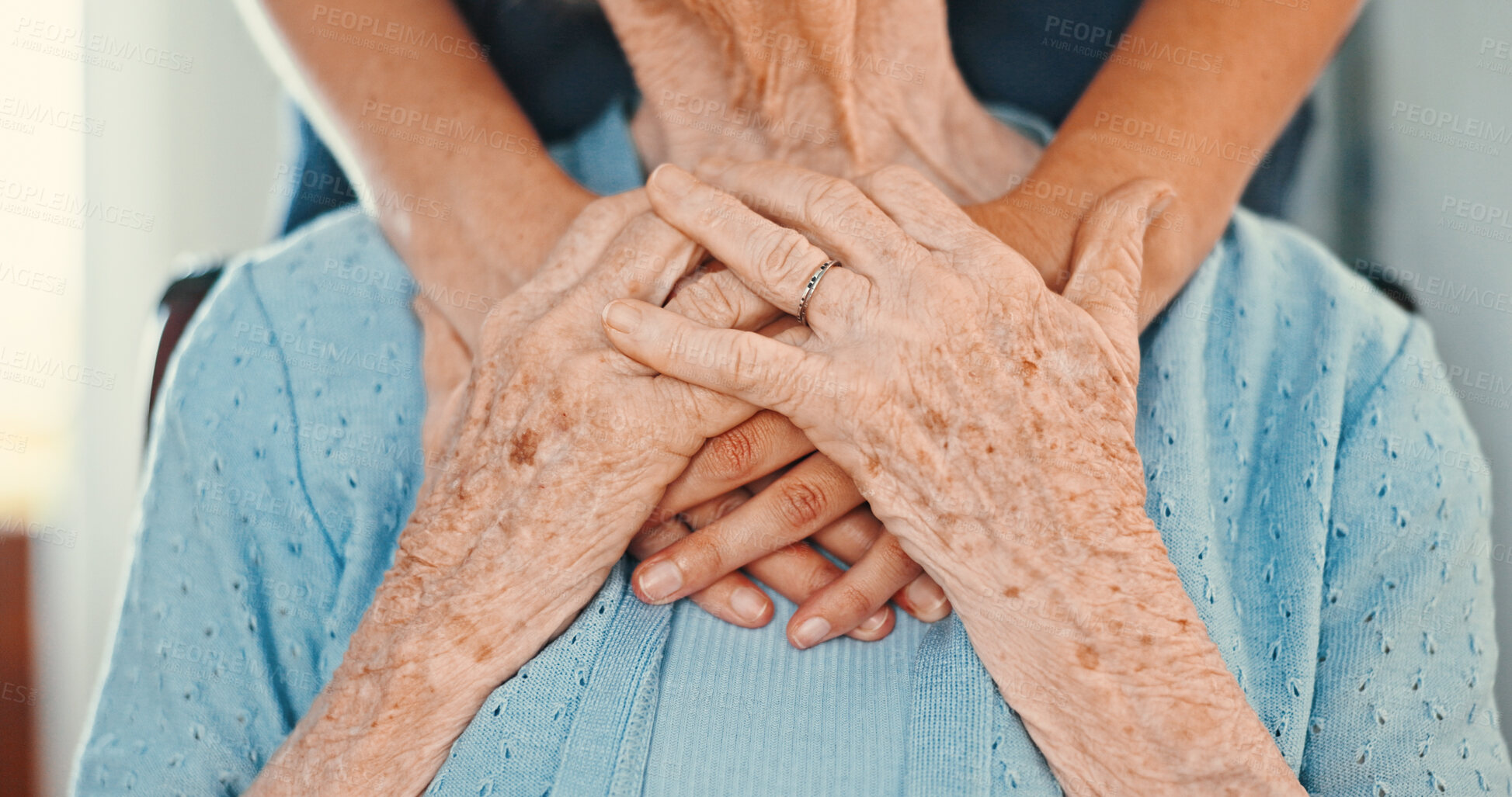 Buy stock photo Holding hands, support and hug with old person in living room for healthcare, caregiver or empathy. Retirement, gratitude and elderly care with closeup of people in nursing home for trust and patient