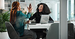 Happy, business women and high five with laptop for teamwork, meeting or winning together at office. Female people, colleagues or employees with smile for celebration, profit or success at workplace