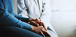 Holding hands, doctor and patient with compassion, healthcare or advice with sympathy in clinic. Closeup, help or professional with results, comfort or review for diagnosis, compassion or empathy