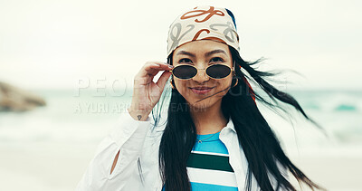 Buy stock photo Portrait, beach and girl with sunglasses, smile and fashion for holiday, adventure or summer vacation. Happy, travel and woman with shades, ocean and confidence with weekend trip to Miami sea