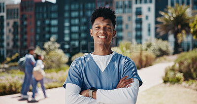 Buy stock photo Man, outdoor and portrait as medical student for learning, career and education in clinic. Male person, smile and confidence for development, healthcare and studying with arms crossed in university