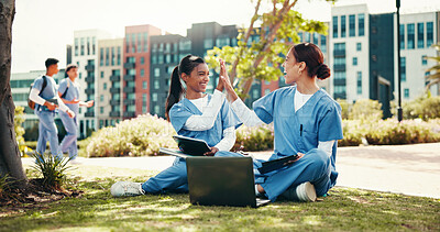 Buy stock photo Happy women, nurse and high five with laptop for internship, medical study or winning at campus. Female people, healthcare students or friends with smile for teamwork or accomplishment at med school