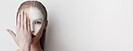 Creative, makeup and portrait of woman in studio with banner space, abstract cosmetics and aesthetic design. Beauty, skin art and girl with face paint, unique identity and mockup on white background