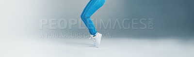 Buy stock photo Legs, person and jump with fun in studio with energy, dancing movement and hip hop performance. Dancer, art and balance with creative routine, competition winner and entertainment on gray background