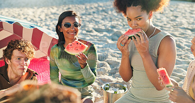 Buy stock photo People, friends and eating with watermelon at beach, picnic and conversation with reunion on vacation. Group, women and men with fruit, happy and outdoor together with diversity by ocean in sunshine