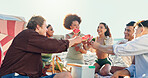 Beach, celebration and group of people with watermelon, smile or bonding on tropical holiday together. Friends, men and women relax at ocean picnic with fruit, outdoor adventure or cheers on vacation