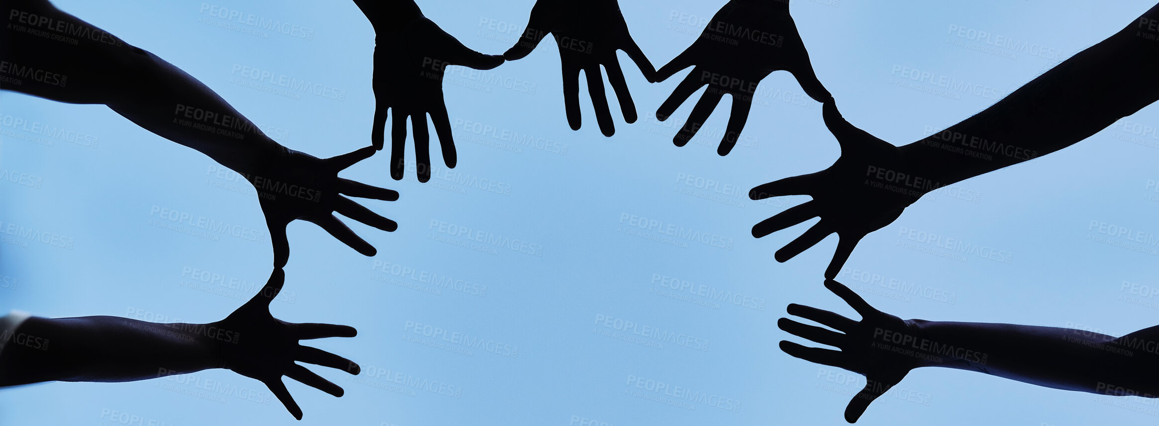 Buy stock photo Hands, silhouette and sky with people in solidarity on space outdoor from below for support or unity. Circle, team building and trust with group of friends on banner mockup for celebration in summer