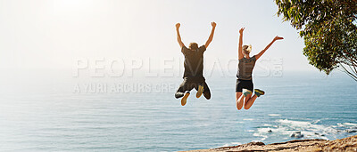 Buy stock photo Ocean view, back and couple jump with celebration, fun and bonding for freedom and fitness. Blue sky, sea and excited people with outdoor hike, travel and summer vacation with mockup banner space