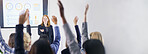 Business, presentation and people with hands up for question, feedback and vote in office banner. Conference, sales team and woman speaker at wall space for info, help or market share stats on screen