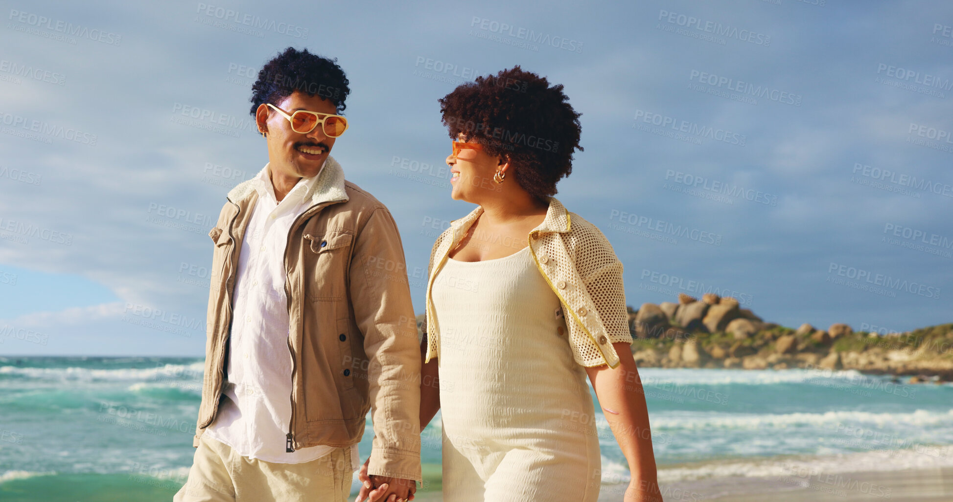Buy stock photo Smile, couple and holding hands for walk on beach with vacation, romantic travel and bonding together. People, sunglasses and ocean with tropical journey, anniversary adventure and summer destination