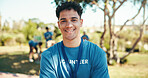 Man, happy and portrait of volunteer outdoor with community service, NGO or donation project. Smile, confident and face of male charity worker with confidence in field in nature for social activism.