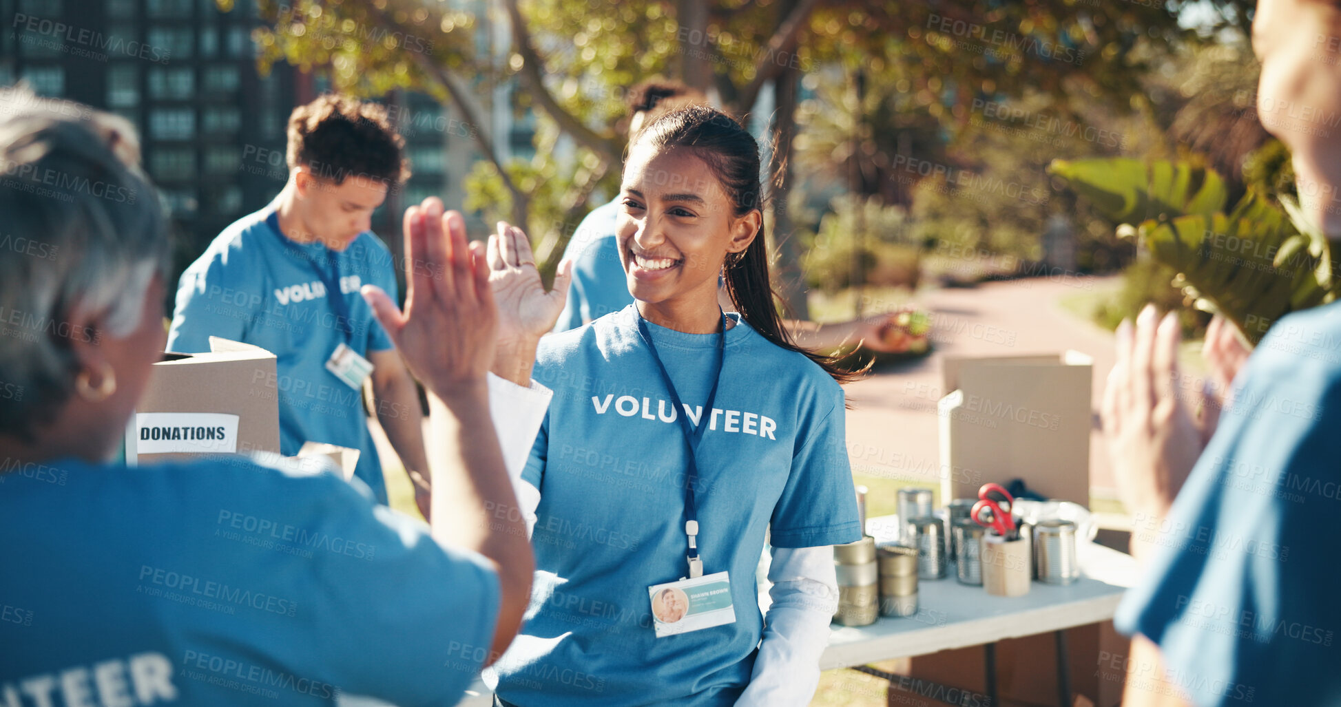 Buy stock photo Outdoor, volunteer and friends with high five, help and goals for donations, charity and support. Non profit, people and group in park, teamwork and gesture with problem solving and community service