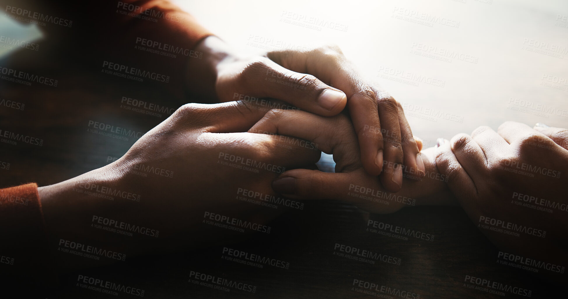 Buy stock photo Couple, holding hands and empathy on table at house for compassion, partnership and consoling of depression. People, support and comfort with relationship crisis, partner trust and loyalty connection