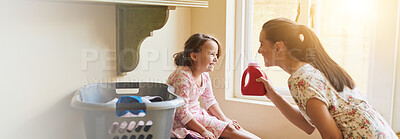 Buy stock photo Happy mom, child and basket with laundry for housework or responsibility together at home. Mother, kid or daughter with smile or washing clothes for helpful childhood, bonding or chores on banner