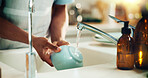 Man, hands and washing dishes in kitchen for hygiene, dirt removal and cleaning with foam. Person, bowl and water in home for bacteria prevention, responsibility or crockery disinfection for care