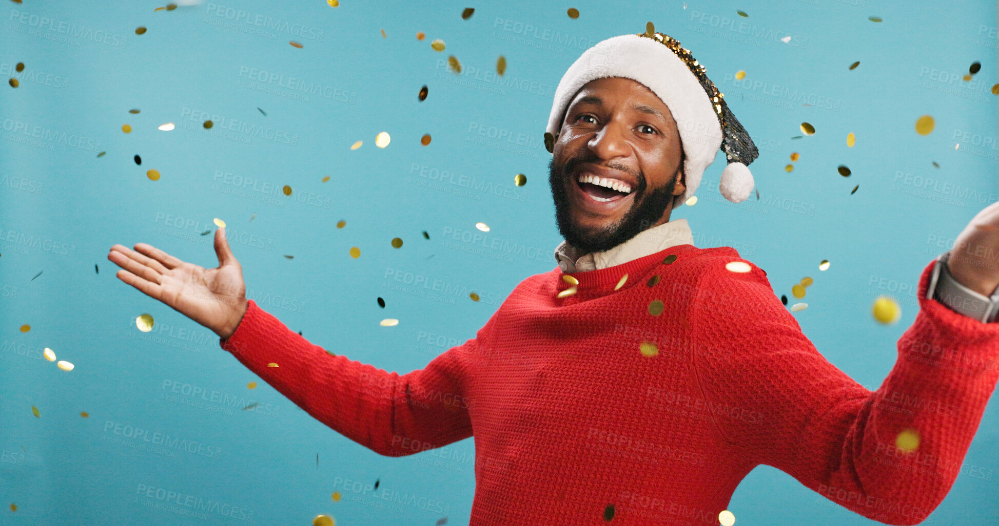 Buy stock photo Christmas, glitter and portrait of happy black man in Santa hat for festive celebration or event. Confetti, music and smile with person in holiday outfit on studio blue background for tradition