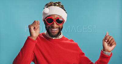 Buy stock photo Christmas, dance and portrait of happy black man in Santa hat for festive celebration or event. Music, smile and sunglasses with person in holiday outfit on studio blue background for tradition