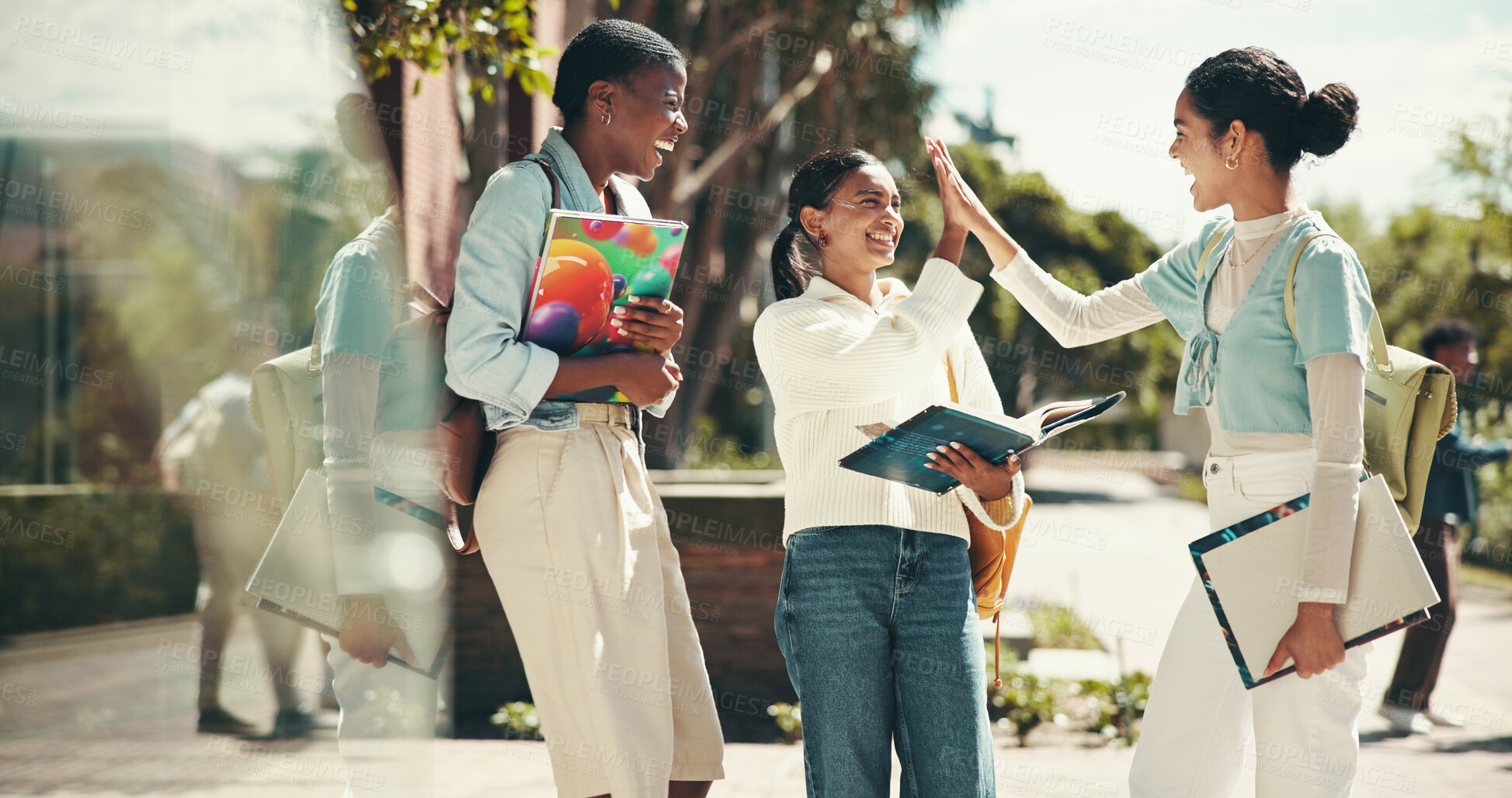 Buy stock photo Student, friends and celebration with high five at college for application success, exam motivation and good news. Support, excited people and books on campus for assignment grade or test achievement