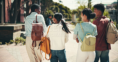 Buy stock photo Back, education and walking with student friends outdoor together for learning or study at university. College, conversation and future with learner group at school for knowledge or scholarship