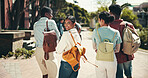 Development, education and walking with student friends outdoor together for learning or study at university. Back, college and portrait with learner group on campus for knowledge or scholarship