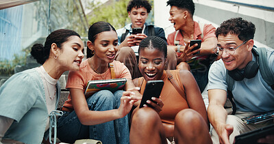 Buy stock photo Students, people and tech on stairs at university, wow and share meme with diversity in low angle at campus. Group, friends and happy on steps with phone, tablet or streaming comic video at college