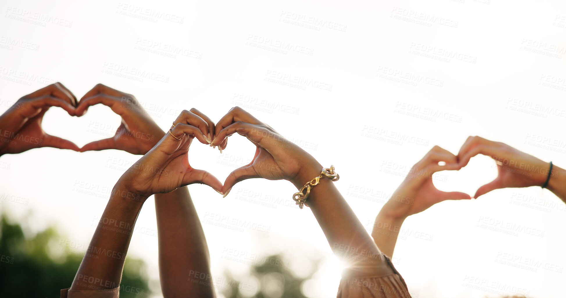 Buy stock photo Friends, people and group with heart hands for love, care or thank you for charity by sky outdoor. Team, support and community with peace gesture for kindness, valentines day sign or gratitude emoji